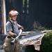 A firefighter removes a hose from a house on Sunday, July 7. Daniel Brenner I AnnArbor.com